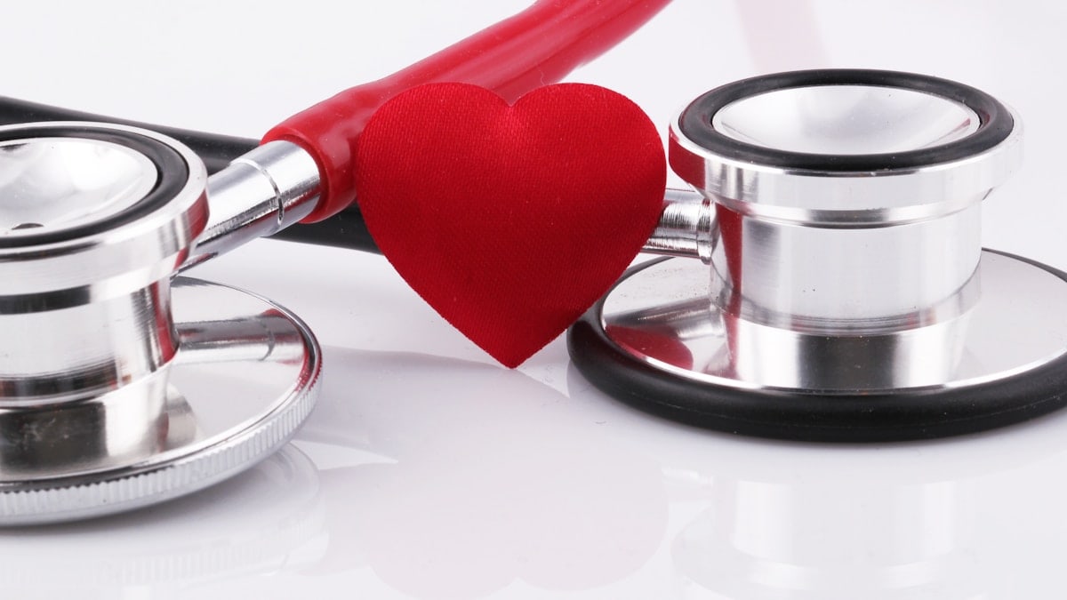 a stethoscope with a red heart on top of it
